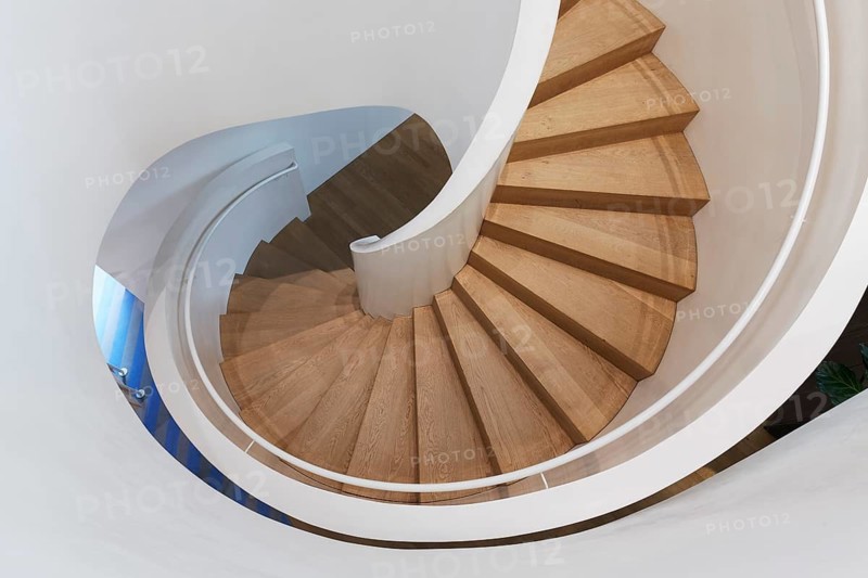 Modern spiral staircase in Vitra Haus, wooden steps, architects Herzog & de Meuron, Vitra Campus, Weil am Rhein, Baden-Württemberg, Germany