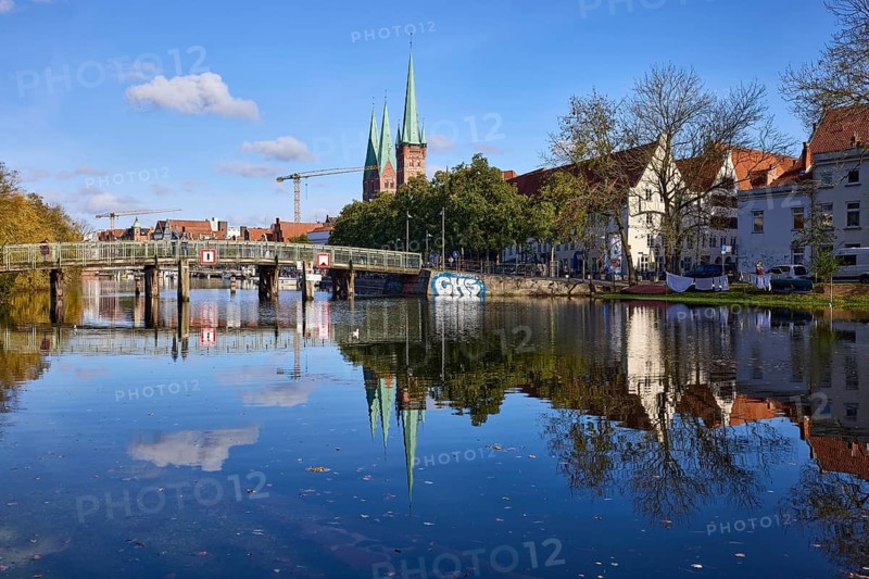Pedestrian bridge Dankwartsbrücke, church towers of St. Petri and St. Marien, general architecture, symmetrical reflections on the water surface, Hanseatic city of Lübeck, independent city, Schleswig-Holstein, Germany
