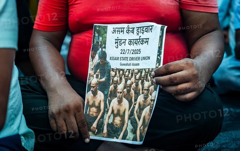 Drivers affiliated with Ola, Uber, and Rapido, under the banner of the Assam State Drivers' Union and the All Assam Cab Welfare Federation, shaved their heads in protest in Guwahati, India, on July 22, 2025. The demonstration held to highlight their demands for fair fare rates, regulation of aggregator commissions, and access to social security and welfare benefits