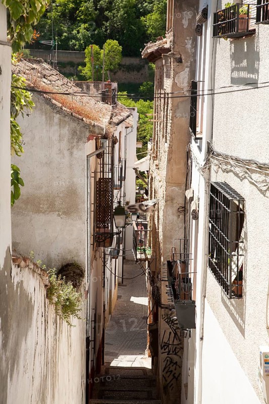 Narrow alleyway named Candil in the Moorish housing district of Albaicin, Granada, Spain