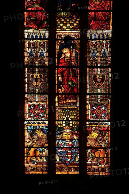 Colourful stained glass window by Alexander Linnemann 1900 with St. Elisabeth and Marburg Elisabeth Church, next to the German Order coat of arms, below the Grand Ducal Hessian coat of arms, historical, Hessian, arts and crafts, stained glass, glass window, black, silhouette, Our Lady, town church, Friedberg, Wetterau, Hesse, Germany