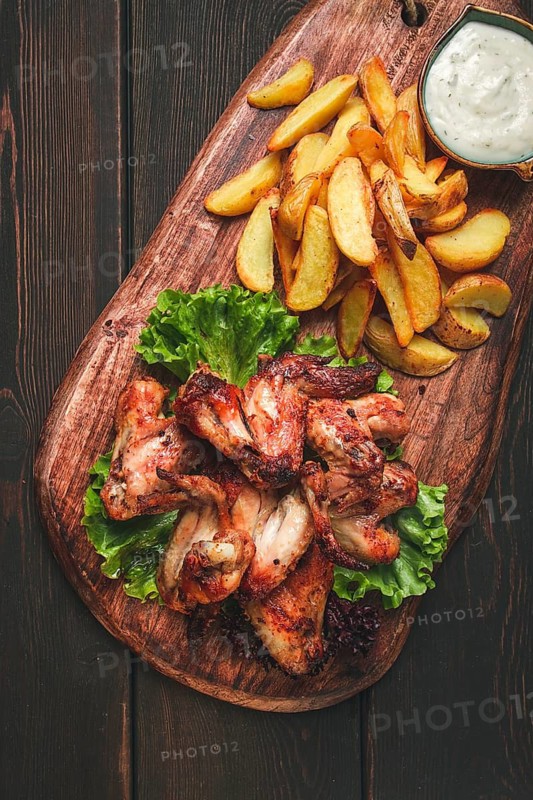 Fried chicken wings, with potatoes, and spices, homemade, fast food, no people