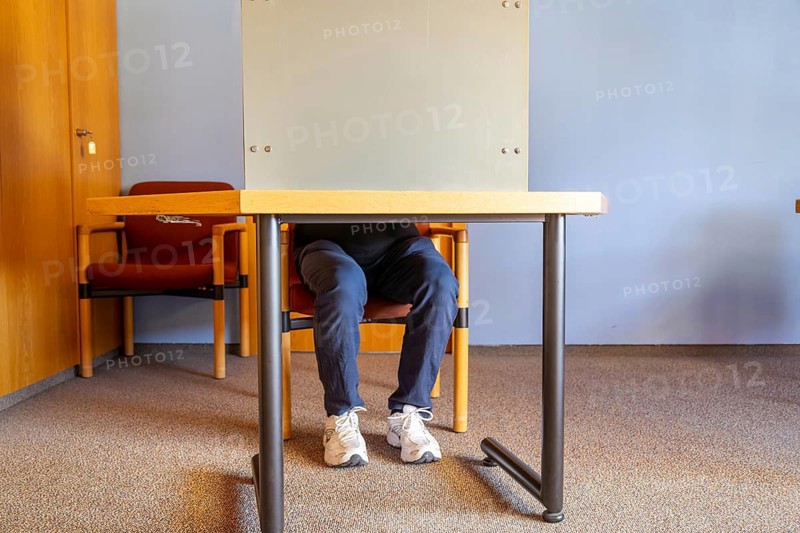 Election symbol: Man in the voting booth