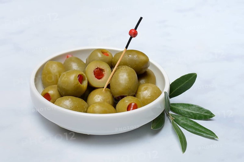 Green olives stuffed with pieces of paprika