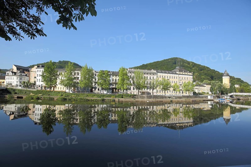 View across the Lahn to the State Statistical Office and Source Tower built in 1907, Spiegelung, Lahnufer, Bad Ems, Rhineland-Palatinate, Germany