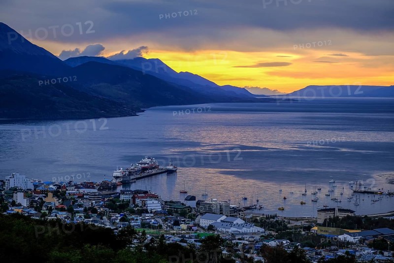 Ushuaia, Tierra del Fuego, Argentina, sunrise over the Beagle Channel, the Beagle Channel is a natural waterway at the southern tip of South America that connects the Atlantic Ocean with the Pacific Ocean. Ushuaia is the southernmost city in the world, the end of the world. Behind mountain range on the island of Navarino in Chile, Dientes de Navarino