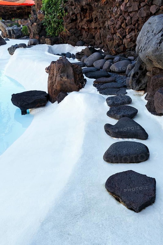 Black lava stones, decoration at the swimming pool, Jameos del Agua, Lanzarote, Spain