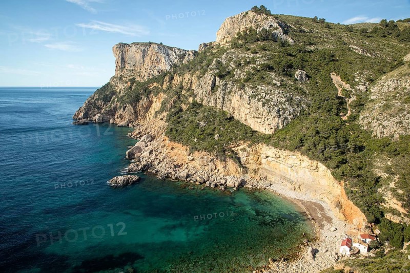 Panoramic views of the rugged cliffs of the Costa Blanca meet the crystal-clear Mediterranean Sea, offering a stunning landscape perfect for relaxing at sunrise or sunset