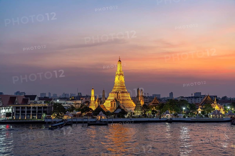 The Buddhist temple Wat Arun or Temple of Dawn and the Chao-Phraya River at dusk, Bangkok, Thailand