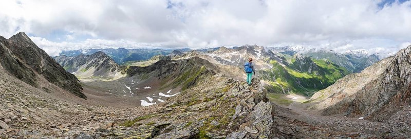 Panorama mountaineer on a steep rocky ridge, at the summit of Lasörling, view of mountains of the Venediger Group, Lasörling Group, Hohe Tauern National Park, East Tyrol, Tyrol, Austria