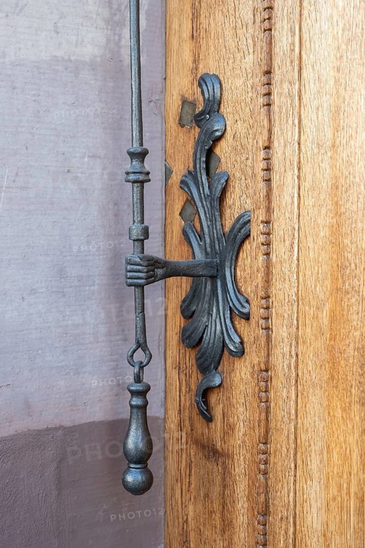 Mechanical doorbell, also known as a lever clamp on a historic town house in the old town of Basel, Canton of Basel-Stadt, Switzerland