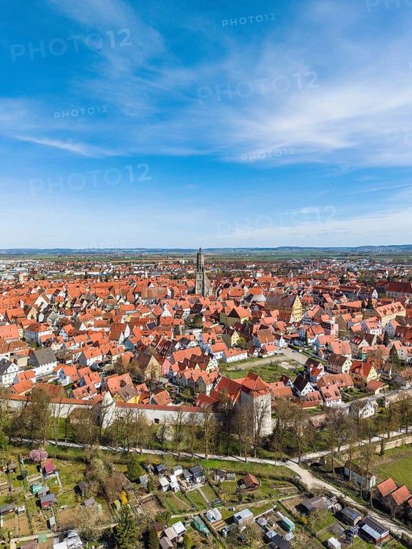 Aerial view, panorama of the historic old town of Nördlingen, with the completely comprehensive and accessible city wall, in the center of the village the church of St. Georg with the 90-meter high church tower, called Daniel, Donau-Ries district, Nördlinger Ries, Bavaria, Germany