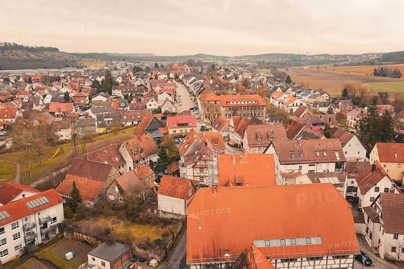 Historic buildings and red roofs characterize the image of a small town environment with paved streets, Ötisheim, Enzkreis, Germany