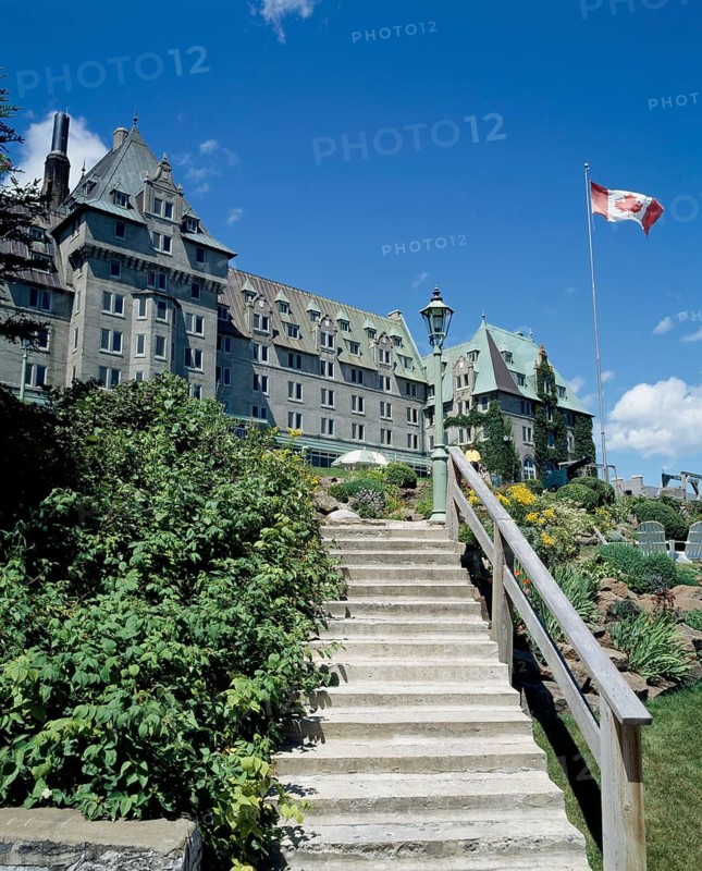 Stairs leading to Manoir Richelieu facade with landscaped frontyard in summer, Charlevoix, Quebec, Canada