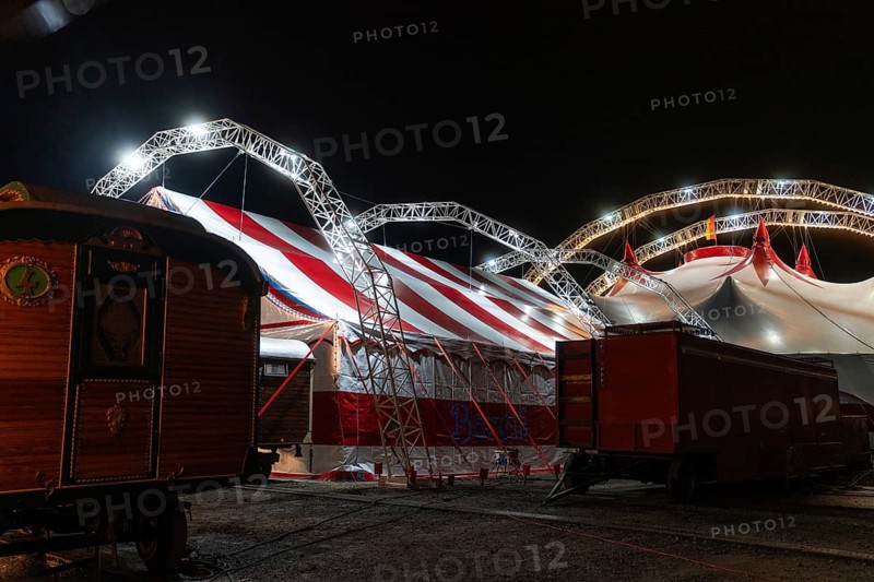 Backyard of a circus with illuminated circus tent and wagon, Böblingen, Germany