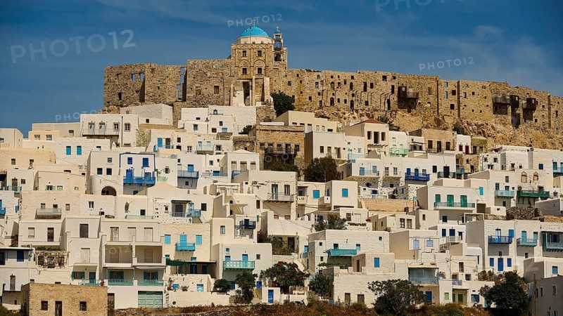 Stone fortress towers over a settlement of white cubic houses, Querini Castle, Chora, Astypalea, Dodecanese, Greek Islands, Greece
