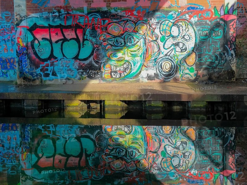 Grafitti under the city railway bridge at Linderner harbour, lock, canal, reflection, Hanover, Lower Saxony, Germany
