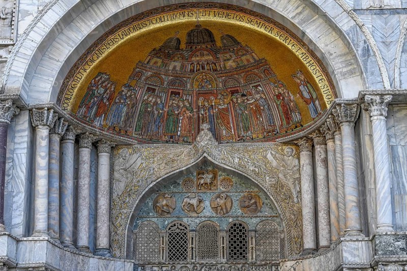 Artistic mosaic over portal of St. Mark's Cathedral, St. Mark's Square, Venice, Veneto Region, Italy