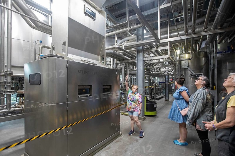 Covington, Louisiana - The Abita Brewing Company's craft beer brewery. A tour guide explains the brewing process to visitors