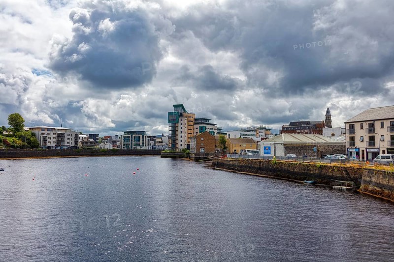 River in a modern city with dramatic sky and clouds, Sligo