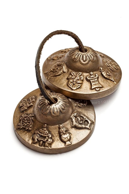 Tibetan Buddhist tingsha cymbals isolated on white