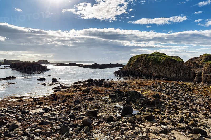 Pristine rocky coastline, coastline, sunbeams, Ballintoy Harbour, Causeway Coastal Route, Antrim, Northern Ireland, Great Britain