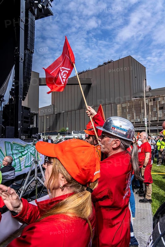 Steelworkers at a demonstration in front of the headquarters of ThyssenKrupp Steel Europe in Duisburg, against massive job cuts, after the participation of a foreign investor in the group, in the background the Oxygen steelworks, Duisburg North Rhine-Westphalia, Germany
