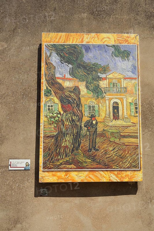 Painting replica pine and figure in front of Saint-Paul-de-Mausole church by Vincent van Gogh, Circut van Gogh Museum, Saint-Paul-de-Mausole, St, Saint-Rémy-de-Provence, Provence, Alpilles, Bouches-du-Rhône, France