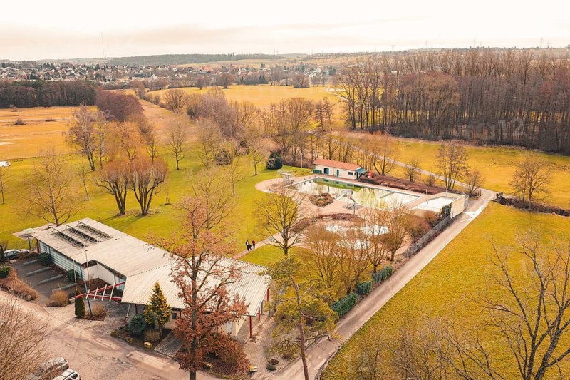 Several buildings in rural surroundings, nestled in meadows and surrounded by trees, Ötisheim, Enzkreis, Germany