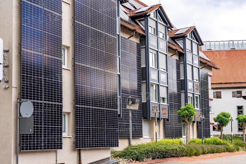 Solar façade, photovoltaic elements on a building façade, hotel in Herrenberg, large PV modules generate electricity on the outer walls of the building, Herrenberg, Baden-Württemberg, Germany