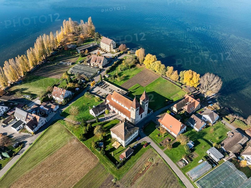 Aerial view of the north-western tip of the island of Reichenau in autumn with the district of Niederzell and the columned basilica of St. Peter and Paul, Lake Constance, district of Constance, Baden-Württemberg, Germany