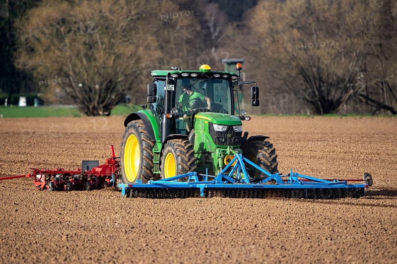 Sugar beet being sown in spring, precision sowing with precision seed drill, behind a tractor, Niederkrüchten, North Rhine-Westphalia, Germany