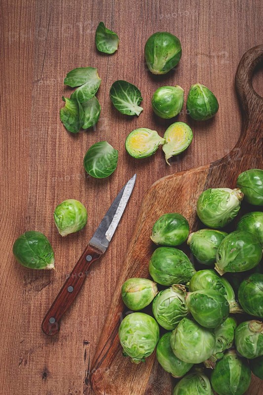 Fresh Brussels sprouts, raw, top view, on a wooden table, no people