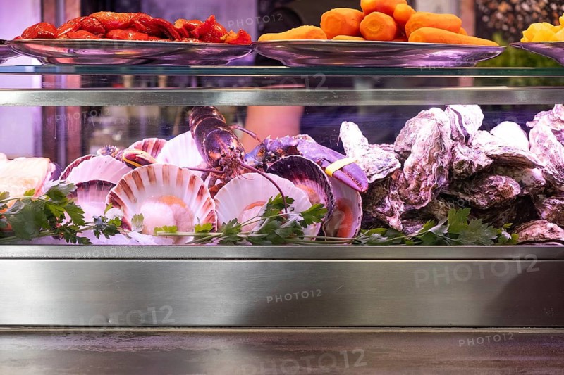 Fish and other seafood at a market stall on the Mercat de la Boqueria, famous market on the Ramblas in Barcelona, Spain