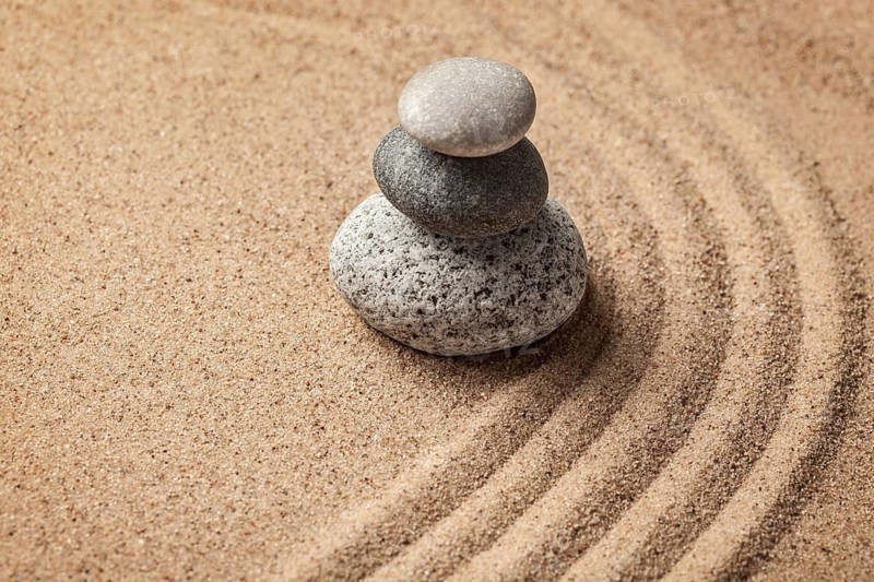 Japanese Zen stone garden, relaxation, meditation, simplicity and balance concept, pebbles and raked sand tranquil calm scene