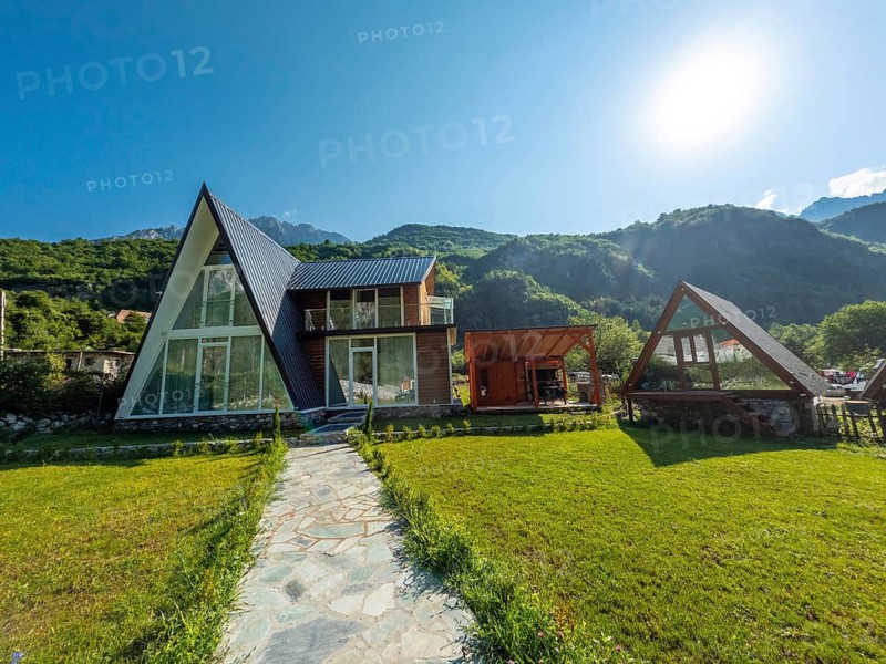 Wooden houses and hotels in the valley of Theth national park, Albania. Albanian Alps