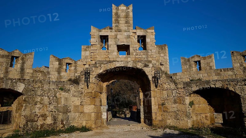 St Paul's Gate, entrance gate of a medieval castle with stone facade and blue sky, harbour area, Rhodes Town, Rhodes, Dodecanese, Greek Islands, Greece