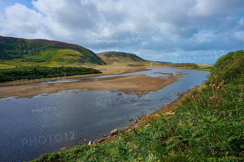 A calm river snakes through a rolling landscape under a cloudy sky, River Naver, Bettyhill, Thurso, Scotland, United Kingdom, Great Britain