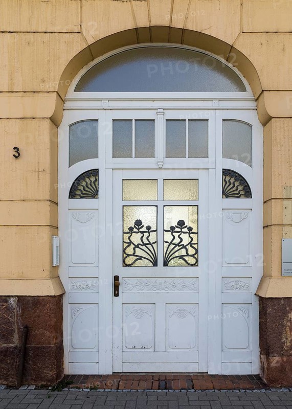 Old door to the old printing house in Rudolf-Breitscheid-Straße, Döbeln, Saxony, Germany