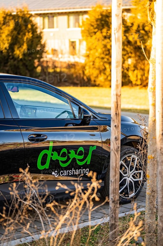 Black electric car in a natural environment with trees, Deer E- Carsharing vehicle MG4, Calw district, Germany