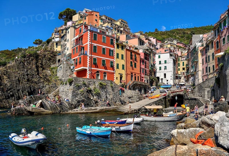 Fishing boats in the harbour of Riomaggiore, village view, Cinque Terre, province of La Spezia, Liguria, Italy