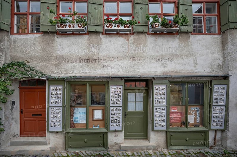Old postcards of Dinkelsbühl in the notice board of a former shop, Dinkelsbühl, Bavaria, Germany