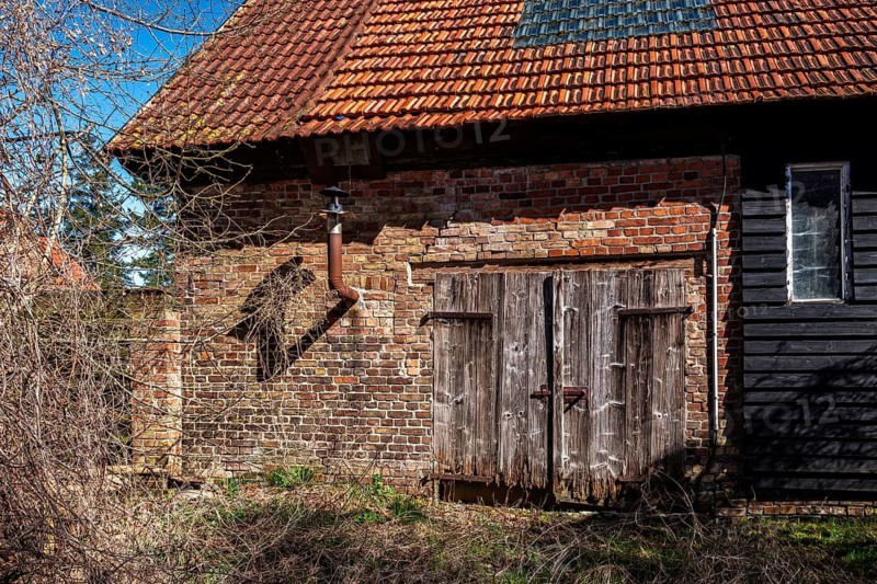 Abandoned and derelict farmhouses on undeveloped land in Rügen, Mecklenburg-Vorpommern, Germany