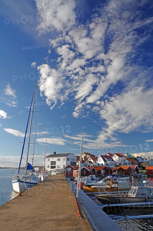 Leisure boats and small harbour and a small island built with wooden houses, Bohuslän, Sweden