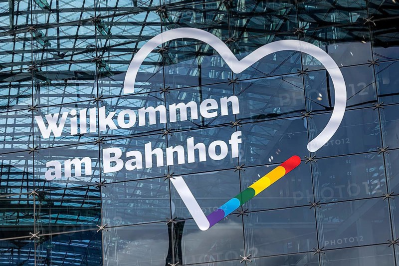 Berlin Central Station. Glass façade with Deutsche Bahn AG logo. Welcome to the train station. Berlin, Germany