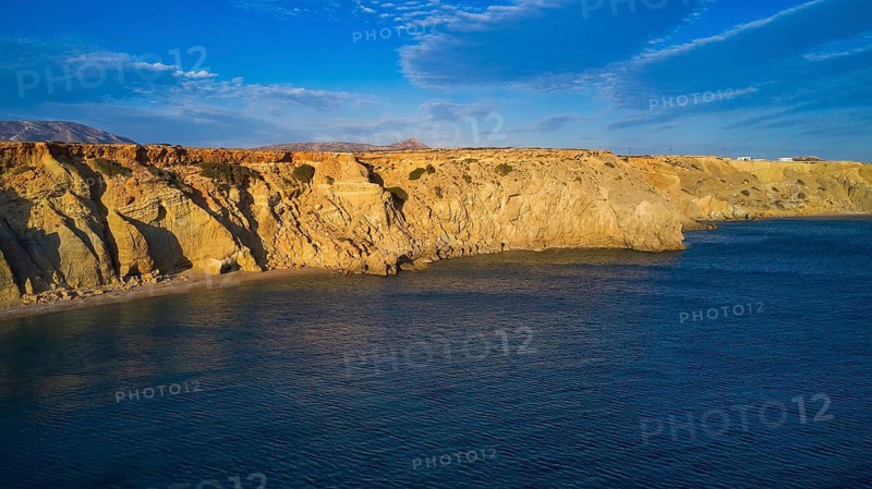 View of the wide sea with rocky coast and blue sky, drone shot, evening light, Paralia Agios Theodoros, Agios Theodoros Beach, south-west coast, Karpathos, Dodecanese, Greek Islands, Greece