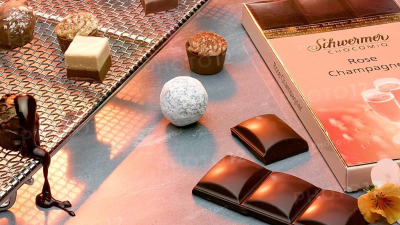 Chocolate, confectionery, pralines on a praline grid, studio shot