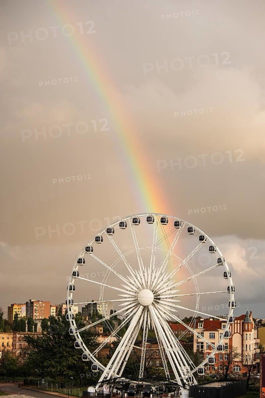 Ferris wheel with rainbow near the Philharmonic Hall in Gdansk, Poland