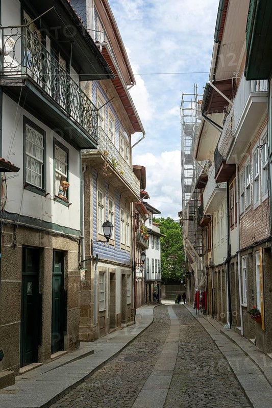 Street of historic buildings with balconies, Rua Egas Montiz, city centre Guimaraes, northern Portugal