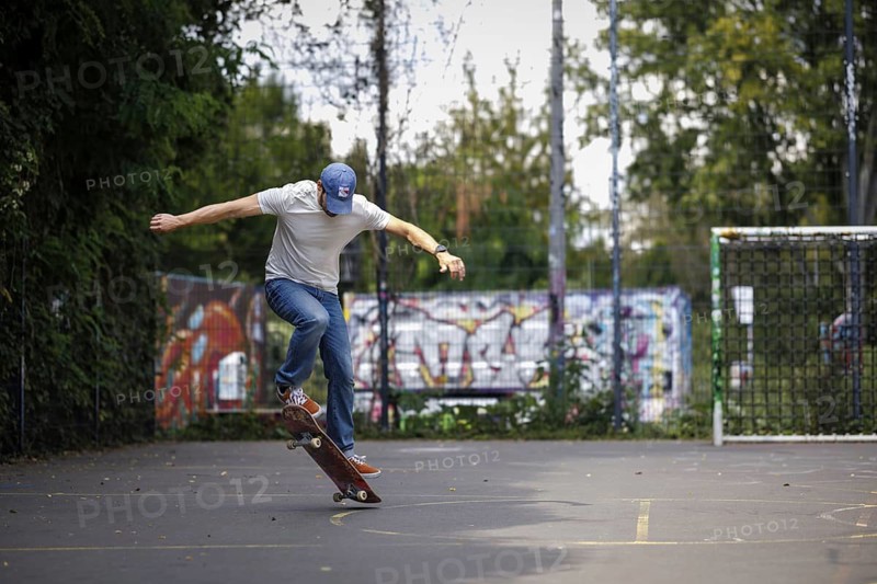 A man does an ollie on a skateboard in Berlin, 16/08/2024